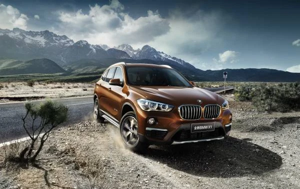 Bronze BMW X1 long-wheelbase model, front three-quarter promotional view, 2016 reference